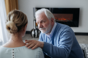 Man consoling a woman