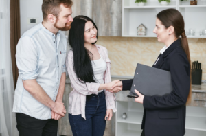 Man and woman cordially meeting with an insurance agent