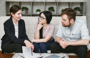 a couple talking to an agent