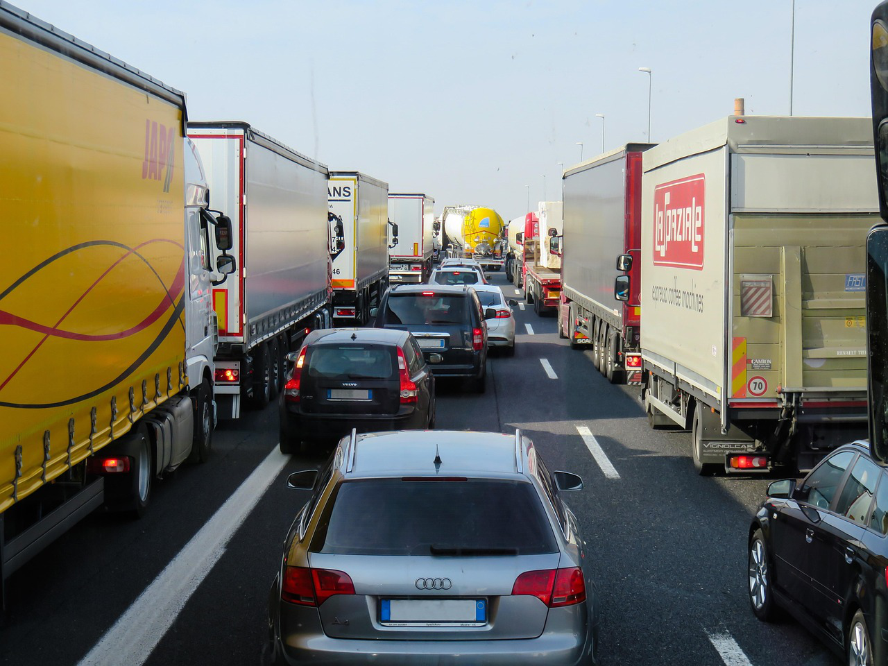 cars and trucks stuck in traffic