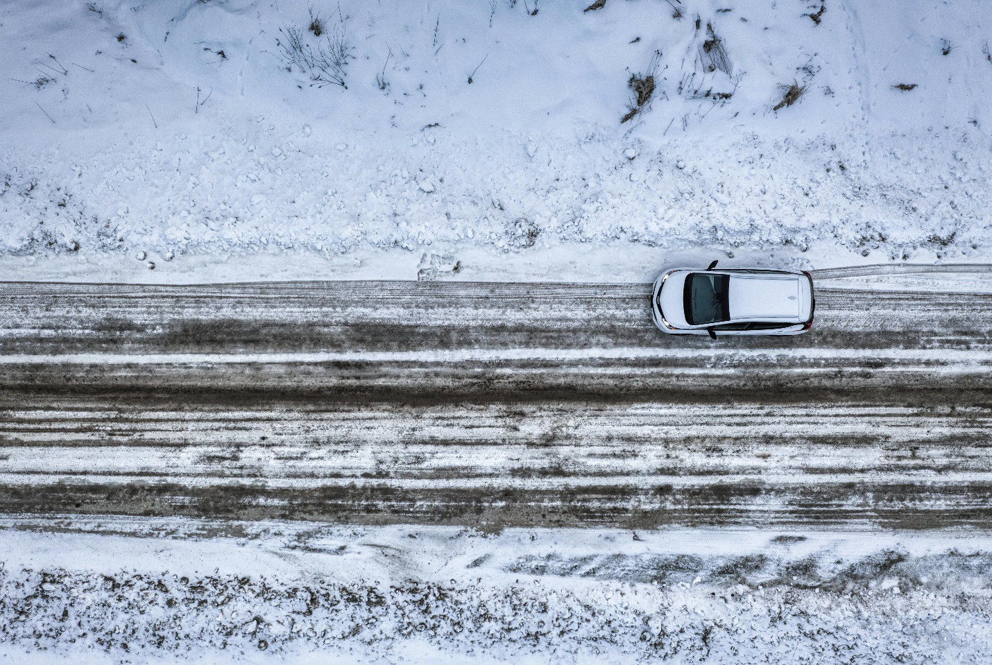 top view of a car driving on an icy road