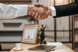 photo of two people shaking hands